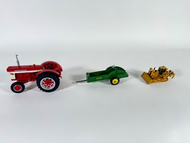 Lot of three International, John Deere and CAT tractors and wagon by Ertl and Norscot