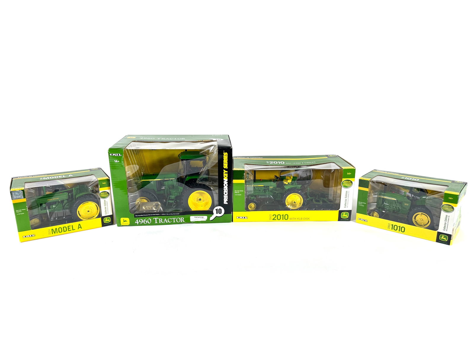 Lot of four John Deere tractors by Ertl in boxes (1 of 1)