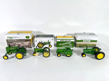 Lot of four John Deere tractors by Ertl with boxes