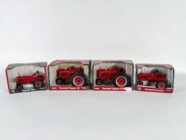 Lot of four McCormick Farmall tractors by Ertl in box