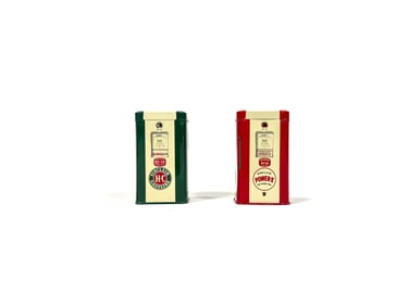 Lot of two 1950s Sinclair Oil promotional gas pump shaped tin coin banks.