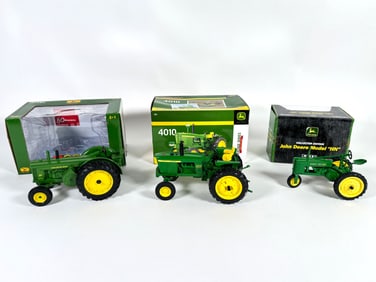 Lot of three John Deere tractors by Ertl with boxes