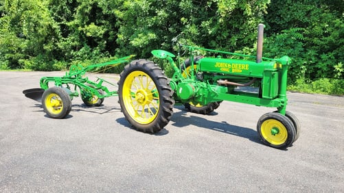 Restored John Deere Model B Tractor with John Deere 2 bottom plow.