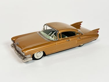 1959 Cadillac 4-dour sedan tin litho friction drive car by Bandai of Japan.