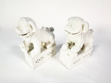 Pair of white porcelain Foo Dogs/ guardian lions.
