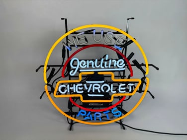 Newer We Used Chevrolet Genuine Parts neon dealership sign.