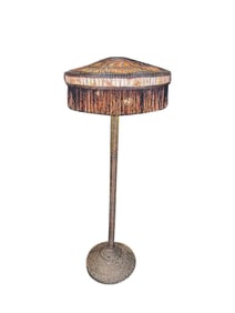 Circa 1920s wicker floor lamp with a fringed boudoir-style lampshade.