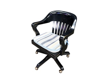 Black wooden swivel desk chair with upholstered cushion.