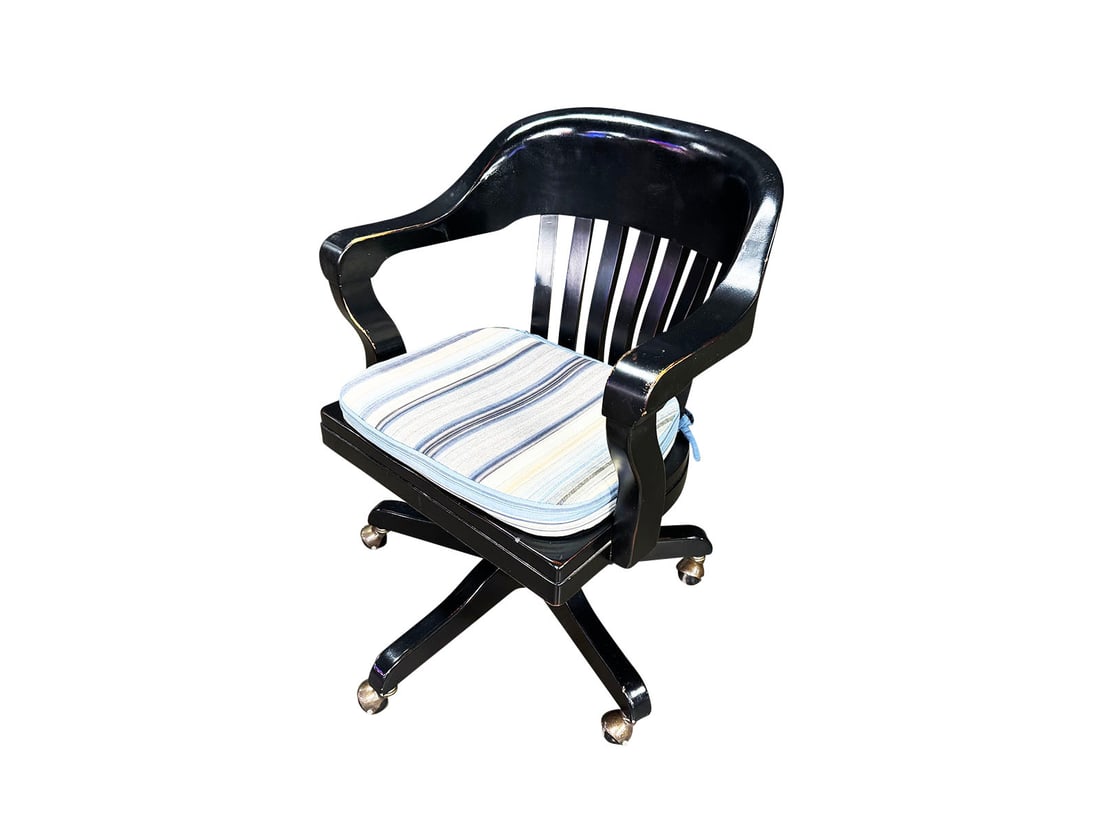 Black wooden swivel desk chair with upholstered cushion.: Black wooden swivel desk chair with upholstered cushion. Presents with general wear. Size: 24"x32"x26".