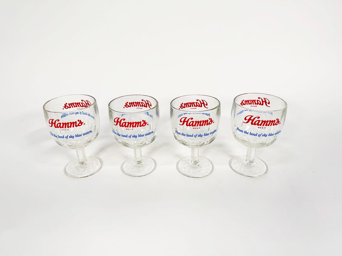 Lot of 4 circa 1950s Hamm's Beer glass tavern mugs.: Lot of 4 circa 1950s Hamm's Beer glass tavern mugs. Features From the Land of Sky Blue Waters slogan. Very clean. Condition: 9.25+. Size: 4"x6"x3".