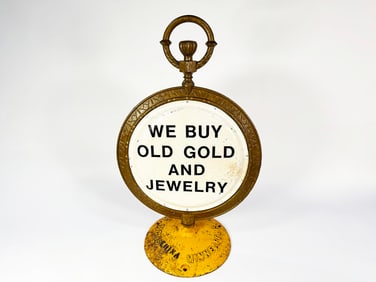 Very heavy vintage cast metal We Buy Gold pocket watch shaped curb sign.