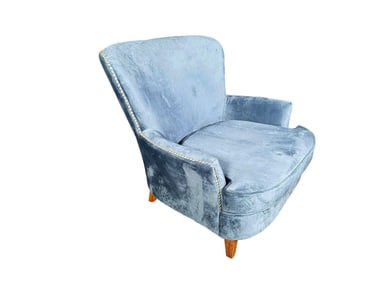 Lovely blue velvet accent chair with nail head trim.