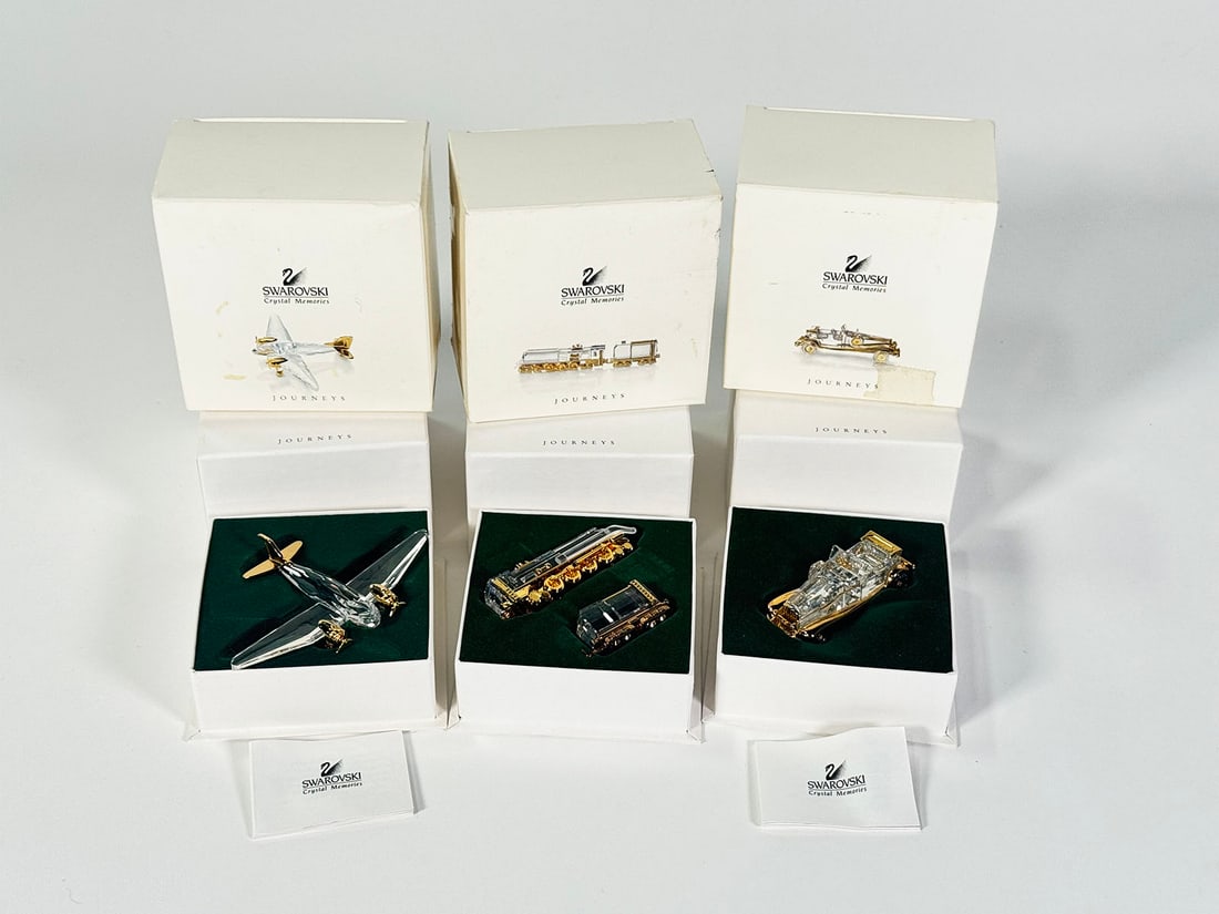 Lot of 3 Swarovski Crystal Jouneys series transportation related sculptures.: Lot of 3 Swarovski Crystal Jouneys series transportation related sculptures. Includes a 1920s Touring Car, Train Engine and an airplane. Presents with boxes and COA. Present well. Size: 4"x4"x3".