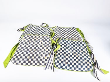Set of 4 MacKenzie-Childs Courtly Check chair seat cushions with green ties and trim.