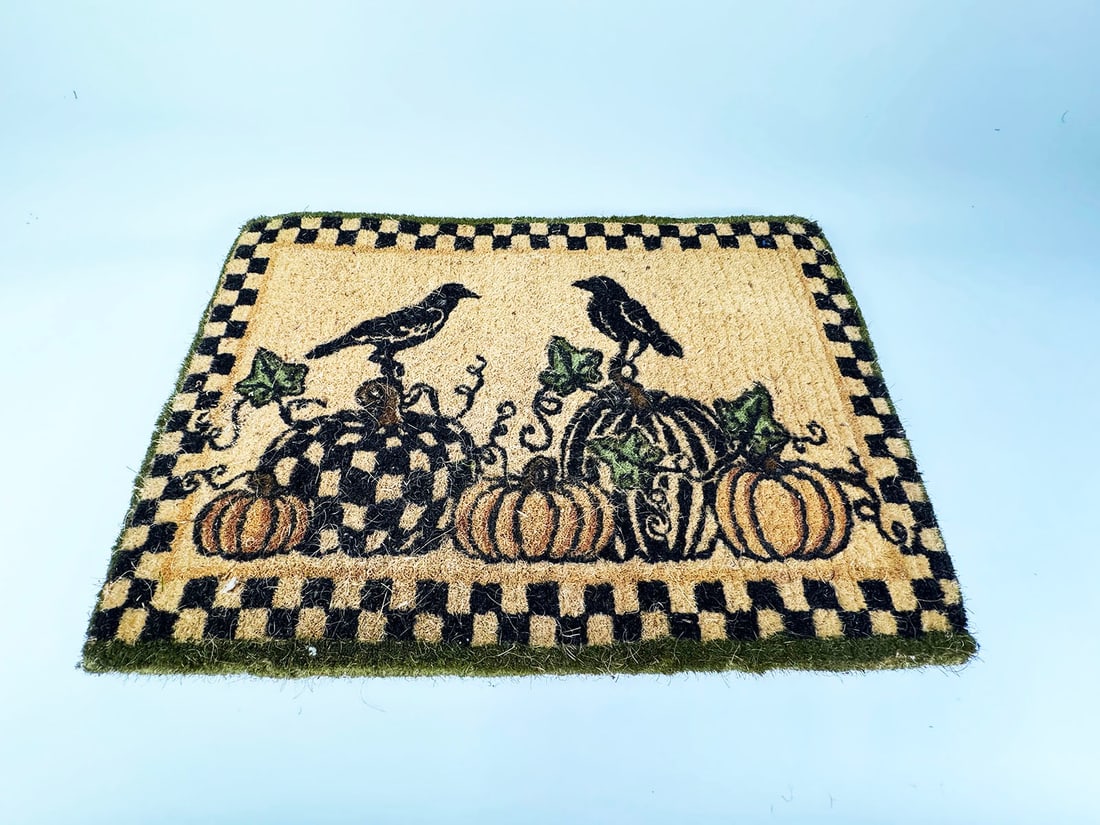 MacKenzie-Childs Courtly Check woven Fall door mat with gourds and ravens depicted. (1 of 2)