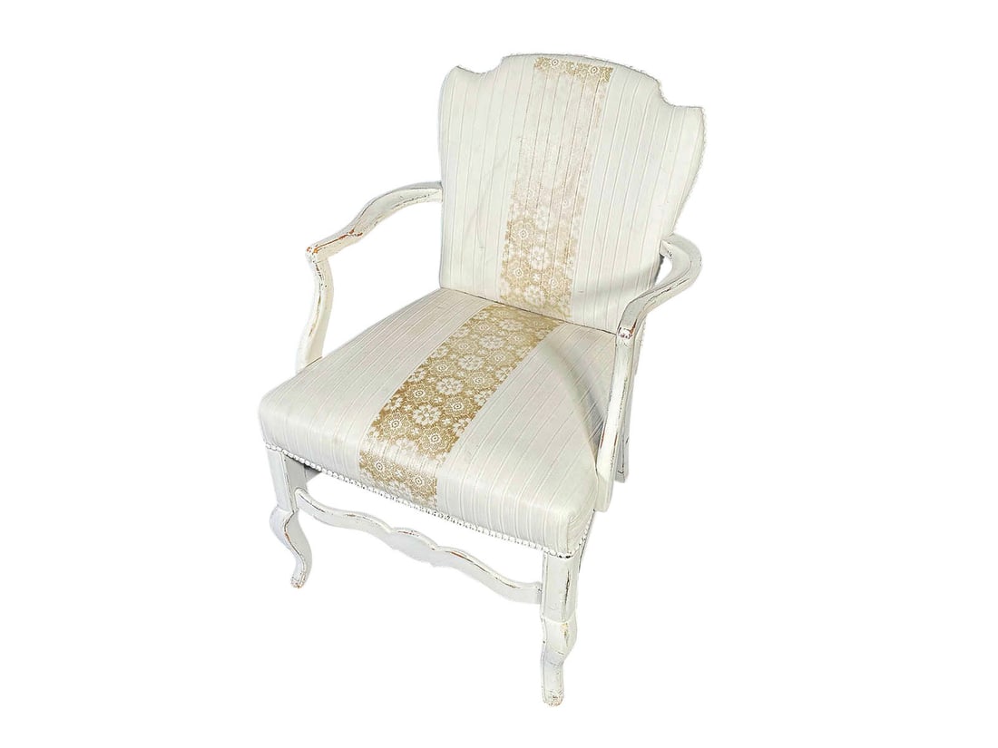Shabby-chic French-style upholstered arm chair.: Shabby-chic French-style upholstered arm chair. Features white washed wood, rich upholstery fabric and nail head trim. Fabric shows some light-wear. Could potentially clean. Size: 24"x34"x22".