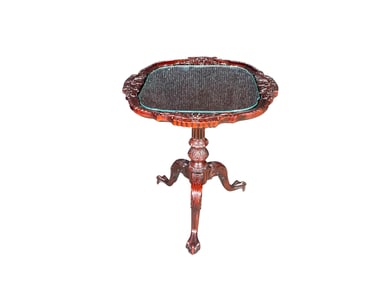 Chippendale-style hardwood pie crust tea table with ball and claw feet.