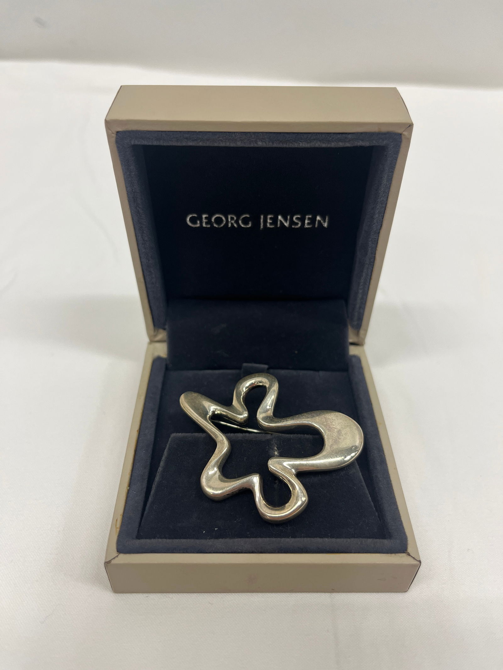 Georg Jensen Sterling Silver Brooch: Modernist “Splash” brooch by Henning Koppel, Georg Jensen, c. 1960s. Marked Design #321. Dimensions: 2 × 1.25 in.