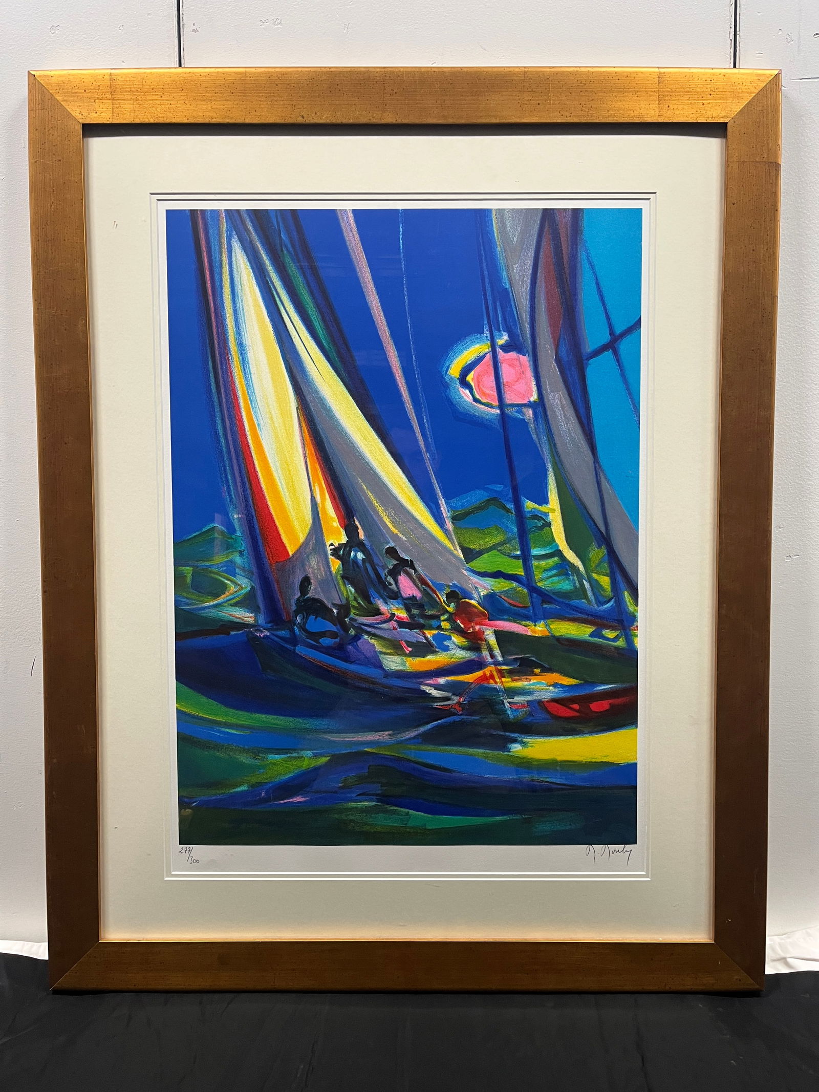 Marcel Mouly “Yachtmen au Ciel Bleu”: Signed and numbered lithograph of sailboat. Framed under acrylic. Dimensions: Frame 46 × 39 × D 1.25 in.