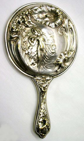 ART NOUVEAU LADIES DRESSING TABLE BEVELLED MIRROR: ART NOUVEAU LADIES DRESSING TABLE BEVELLED MIRROR * MEASURES 10" TALL AND 6" IN DIAMETER * HAS A ONE INCH VARIATION IN RELIEF * BEVELLED MIRROR *SILVER PLATED * VERY HEAVY MADE WITH BEAUTIFUL 3D DESIG