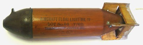 WWII AIR CRAFT FLOAT LIGHT DROP BOMB: WWII AIR CRAFT FLOAT LIGHT DROP BOMB * BOMB IS APROX. 13 1/2" TALL * HAS NICE SOLID WOODEN BODY * NOSE IS APPLIED WITH SMALL SCREWS * AIRCRAFT FLOAT LIGHT MARK 4 7-40 TRIUMPH EXPLOSIVES INC. * INERT *