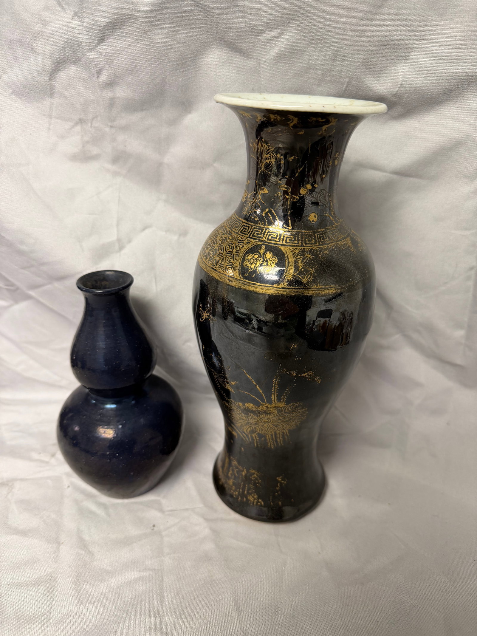 Set Of 2 Chinese Black Glazed Gilded Porcelain Vases: Size: 6.5-10 inch, 16.3-25.4cm. Provenance: From Elkton MD collector. We can offer Affordable, Reliable packing and shipping to all over the world for most items, generally save 10% than UPS store or