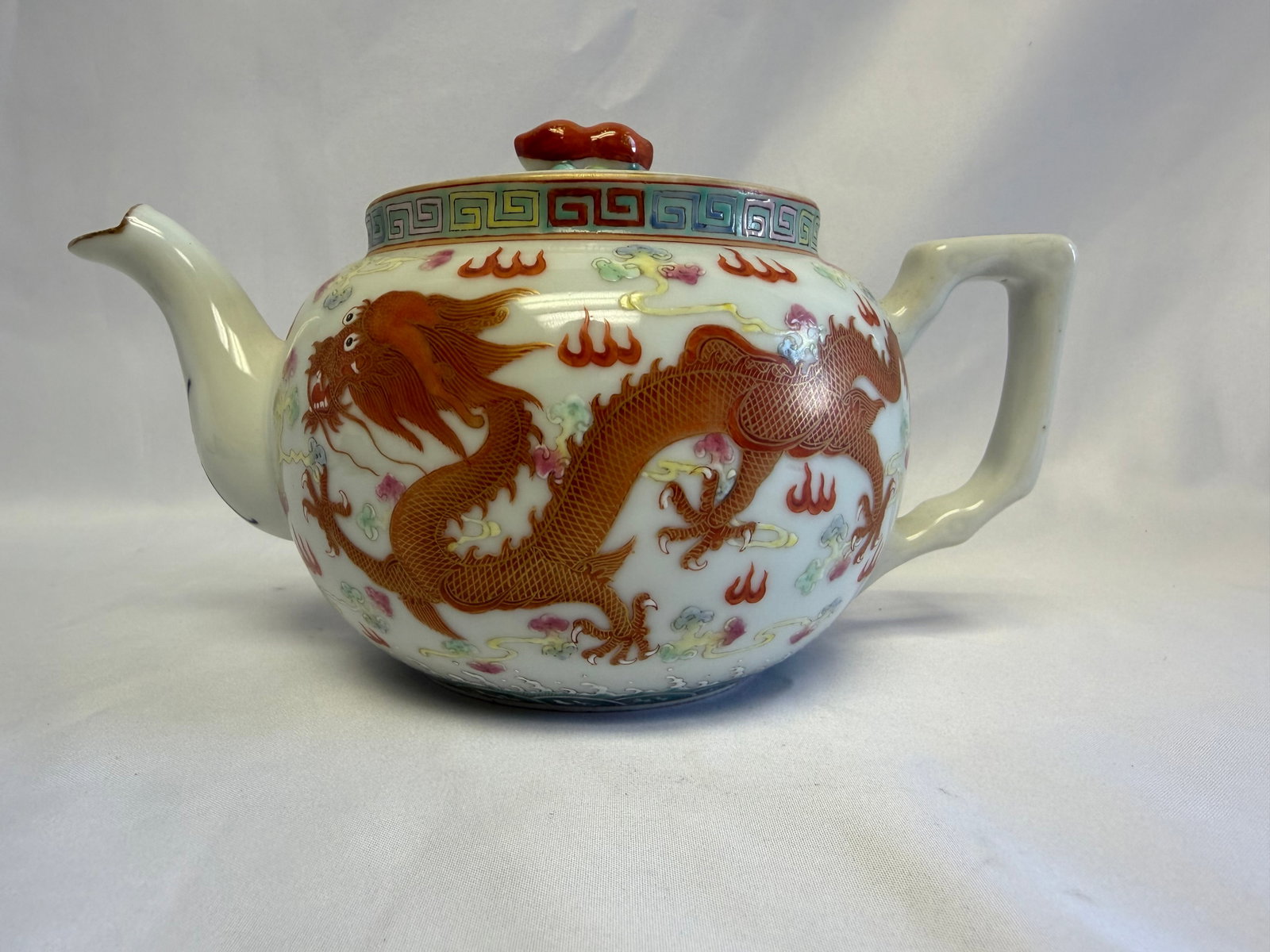 Chinese Enameled Famille Rose Dragons And Phoenix Gilded Porcelain China Teapot Six Characters Mark: Size: Tall 5 inch. Provenance: From Bear DE collector. Preview Day: Preview open On Jun 13th Sat 10AM-4 PM, welcome. We can offer Affordable, Reliable packing and shipping to all over the world for mo