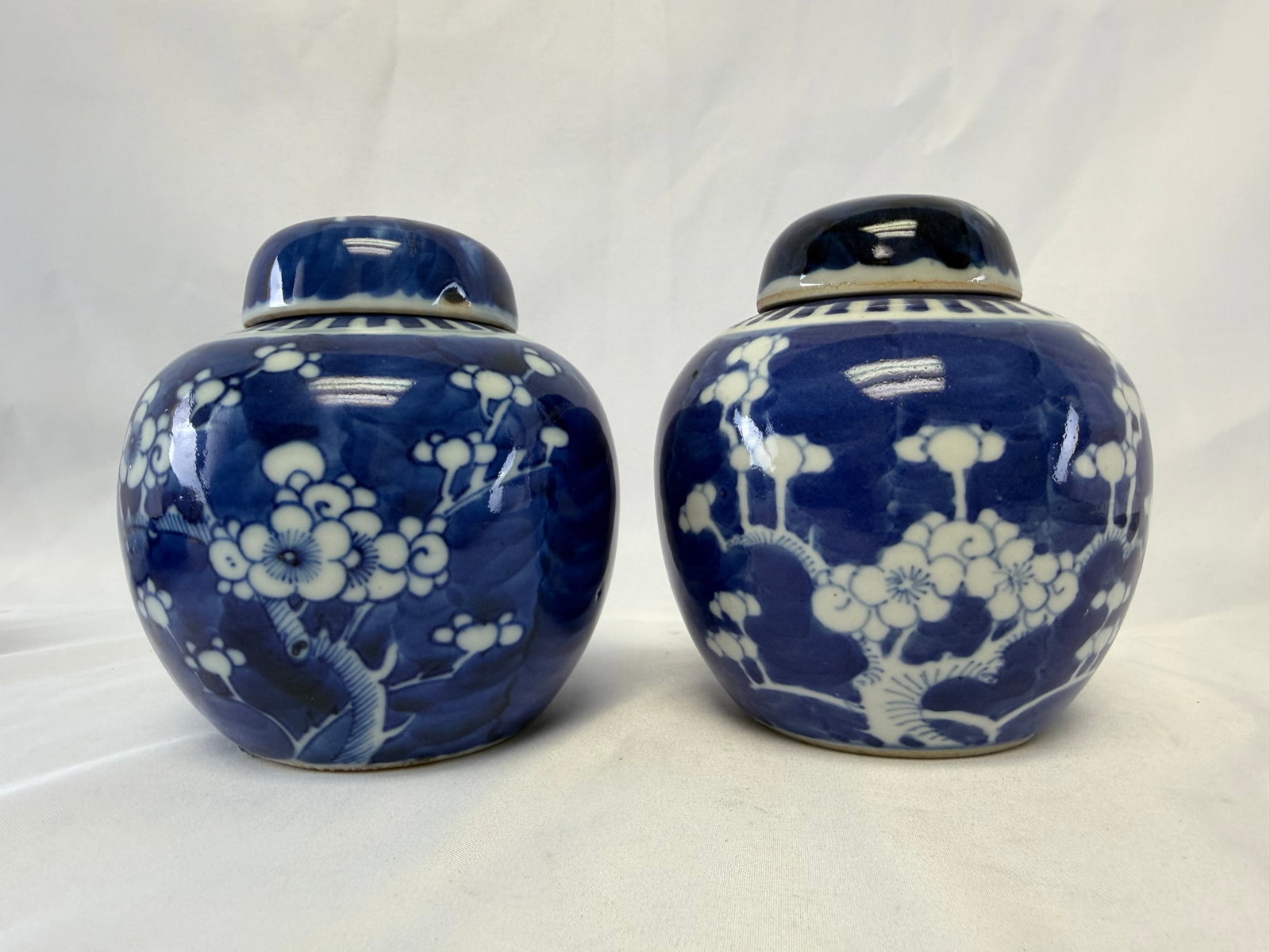 Pair Of Chinese Blue And White Plum Blossom Porcelain China Ginger Jars: Size: 5.3 inch. Provenance: From New Castle DE collector. Preview Day: Preview open On Jun 13th Sat 10AM-4 PM, welcome. We can offer Affordable, Reliable packing and shipping to all over the world for