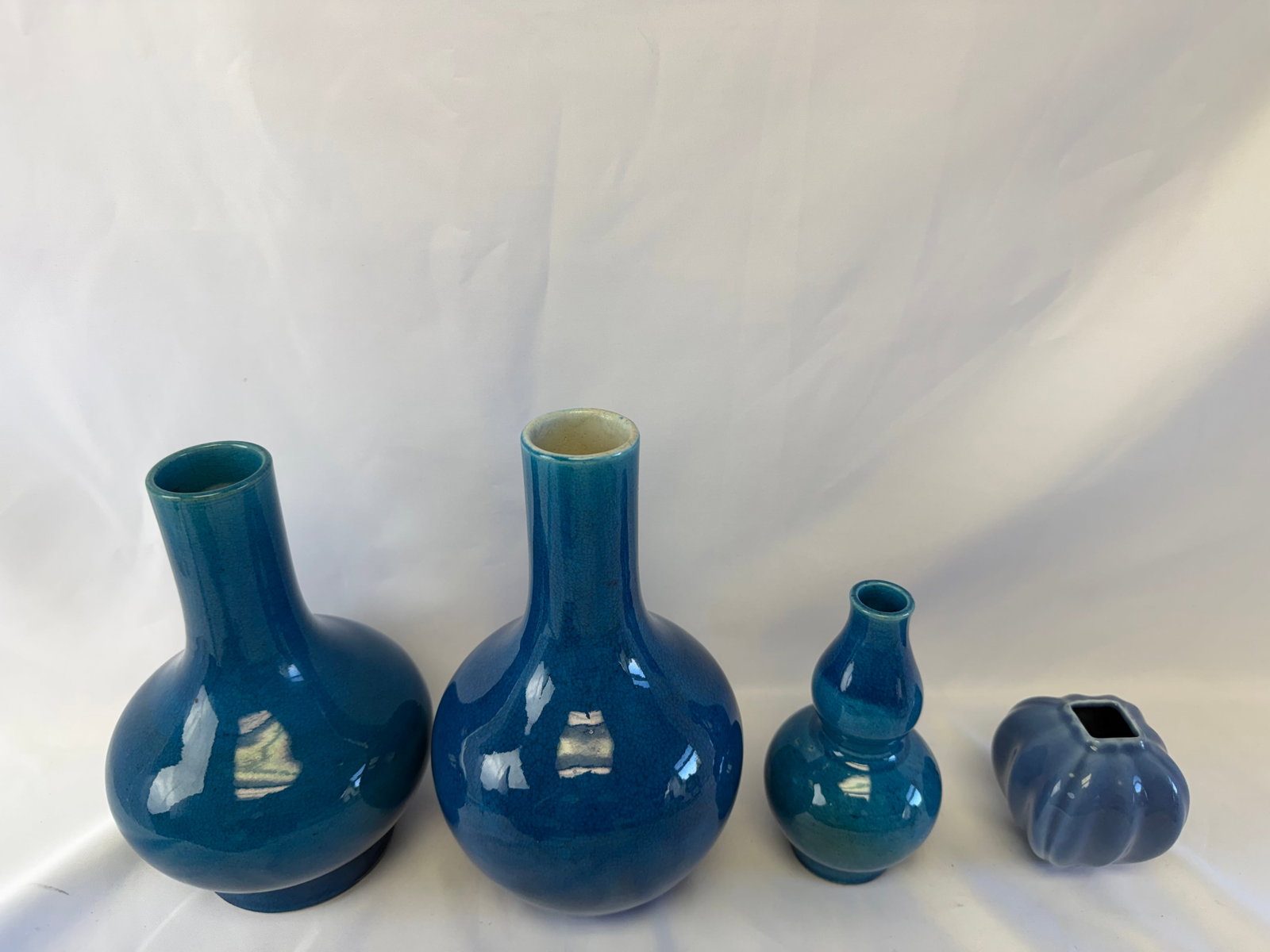 Set of 4 Chinese Blue ice crack glazed Porcelain vases: Size: the biggest one tall 8 inch. Provenance: From bear DE collector. Preview Day: Preview open On Sep 5th Sat 10AM-4 PM, welcome. We can offer Affordable, Reliable packing and shipping to all over t