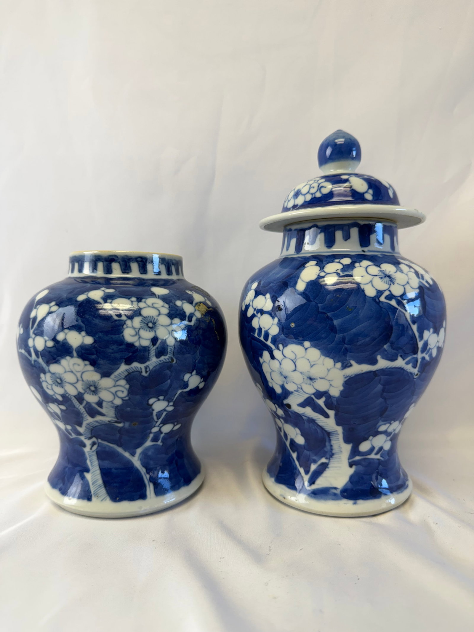 Set of 2 Chinese antique blue and white plum blossom porcelain jars: Size: with lid tall 9 inch, one has no lid. Provenance: From Deep water NJ collector. Preview Day: Preview open On Sep 5th Sat 10AM-4 PM, welcome. We can offer Affordable, Reliable packing and shippin