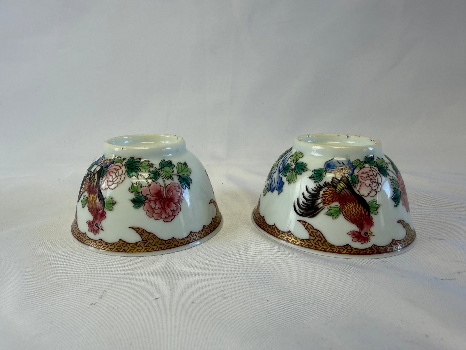 Pair of Chinese famille rose porcelain China tea cups: Size: width 2.9 inch. Provenance: From bear DE collector. Preview Day: Preview open On Sep 5th Sat 10AM-4 PM, welcome. We can offer Affordable, Reliable packing and shipping to all over the world for 