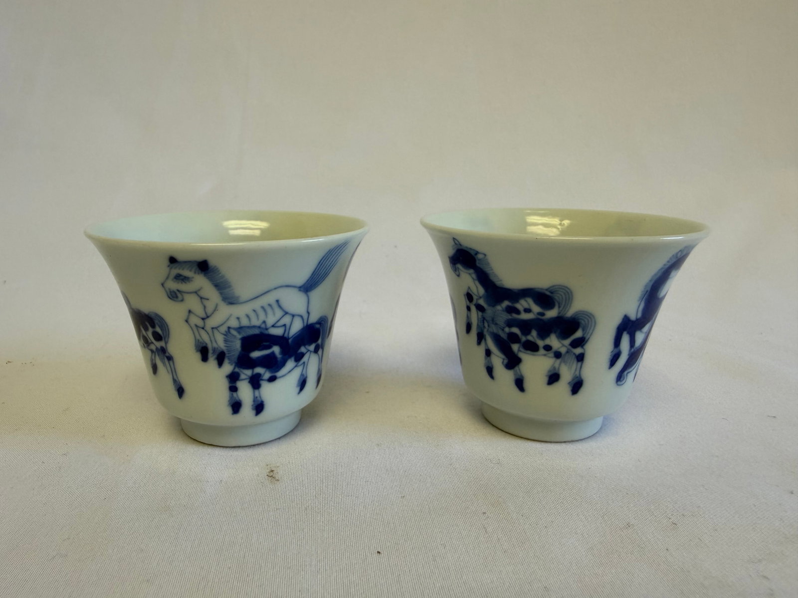 Pair of Chinese Blue And White horse Porcelain China cups: Size: 2 inch. Provenance: From Glassboro PA collector. Preview Day: Preview open On Sep 5th Sat 10AM-4 PM, welcome. We can offer Affordable, Reliable packing and shipping to all over the world for mos