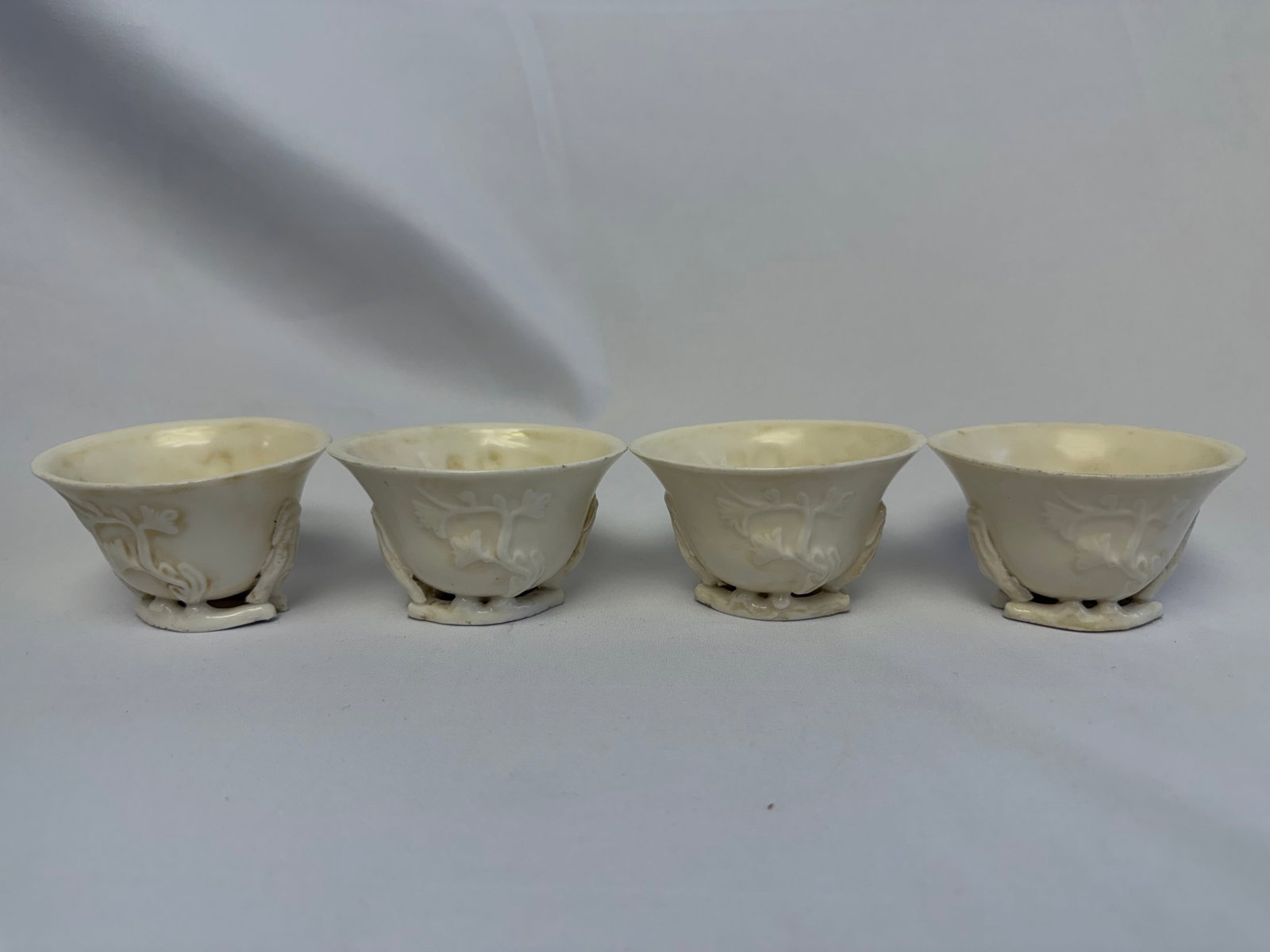 Set of 4 Chinese antique white glazed plum blossom porcelain tea cups: Size: width 3.3 inch. Provenance: From West Media PA collector. Preview Day: Preview open On Sep 5th Sat 10AM-4 PM, welcome. We can offer Affordable, Reliable packing and shipping to all over the worl