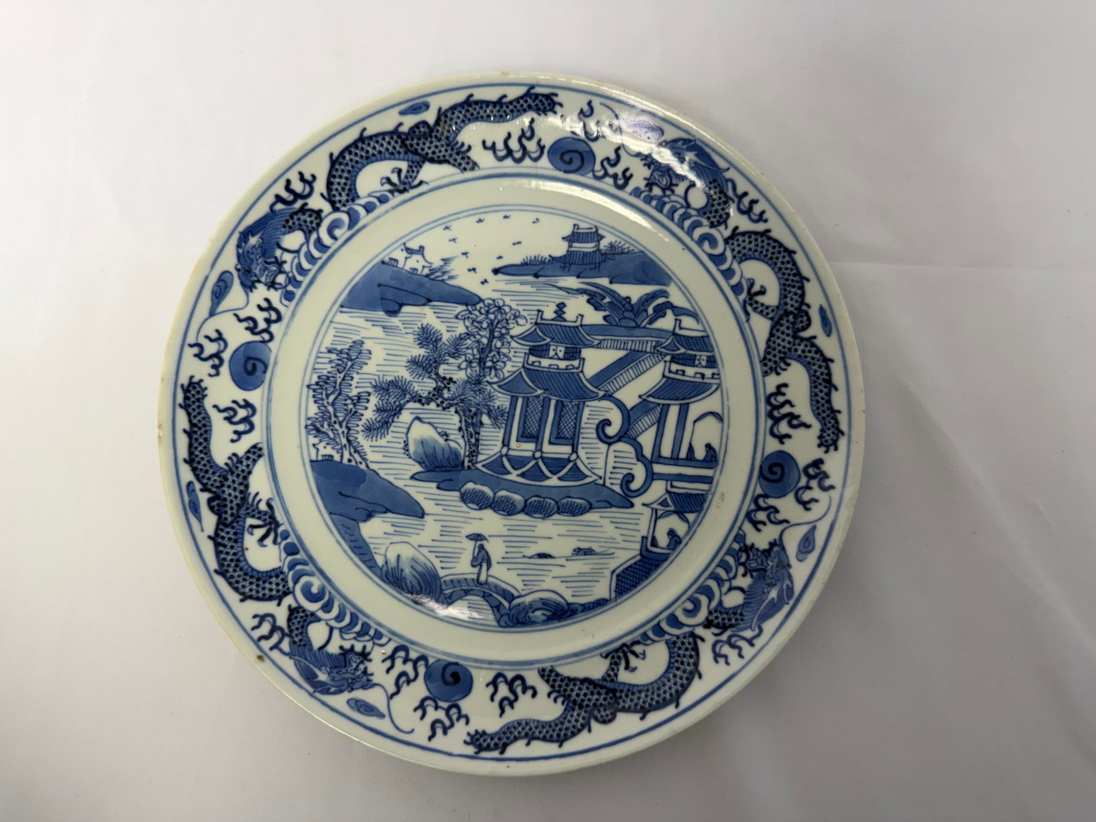 Chinese blue and white dragons and landscape plate: Size: 8.6 inch. Provenance: From West Media PA collector. Preview Day: Preview open On Sep 5th Sat 10AM-4 PM, welcome. We can offer Affordable, Reliable packing and shipping to all over the world for 