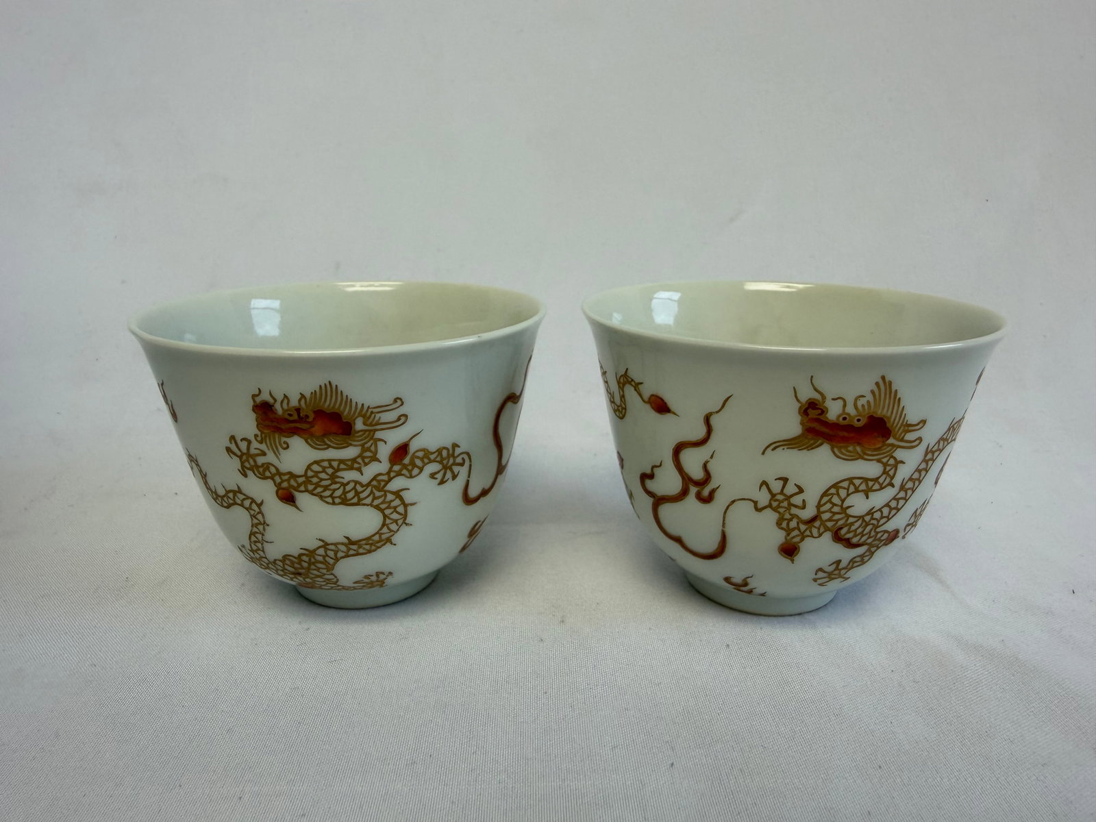 Chinese famille rose gilded dragons porcelain cups blue and white mark: Size: 2.6x2 inch. Provenance: From Wilmington DE collector. Preview Day: Preview open On Sep 5th Sat 10AM-4 PM, welcome. We can offer Affordable, Reliable packing and shipping to all over the world fo
