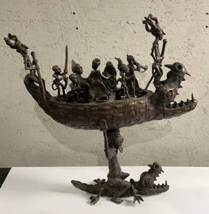 21" Benin Bronze Crocodile Boat: Buyer Premium 10% BP 21" Benin Bronze Crocodile Boat Located in: Chattanooga, TN A 21* Benin-Nigeria bronze sculpture of a crocodile boat and figures inside representing ancestors or primordial figure