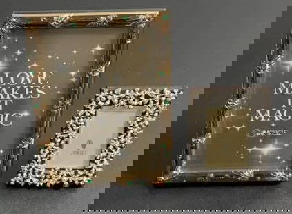 (2) L'Objet Picture Frames: Buyer Premium 10% BP MFG L'Objet Picture Frames Located in: Chattanooga, TN Pair of picture frames by L'objet. The "Garland" frame design is meticulously handcrafted with platinum plating, white Swaro