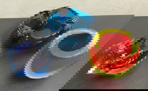 (3) Flavio Poli Murano Glass Ashtrays: Buyer Premium 10% BP MFG Flavio Poli Murano Glass Ashtrays Located in: Chattanooga, TN A three piece lot of modern art glass featuring an amethyst Sommerso ashtray (3.5") by Flavio Poli for Seguso. Th