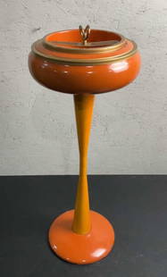 Italian MCM Orange Ashtray Stand: Buyer Premium 10% BP Italian MCM Orange Ashtray Stand Located in: Chattanooga, TN A vintage Italian designed ashtray stand with enameled orange finish and brass trimming. The ashtray container is remo