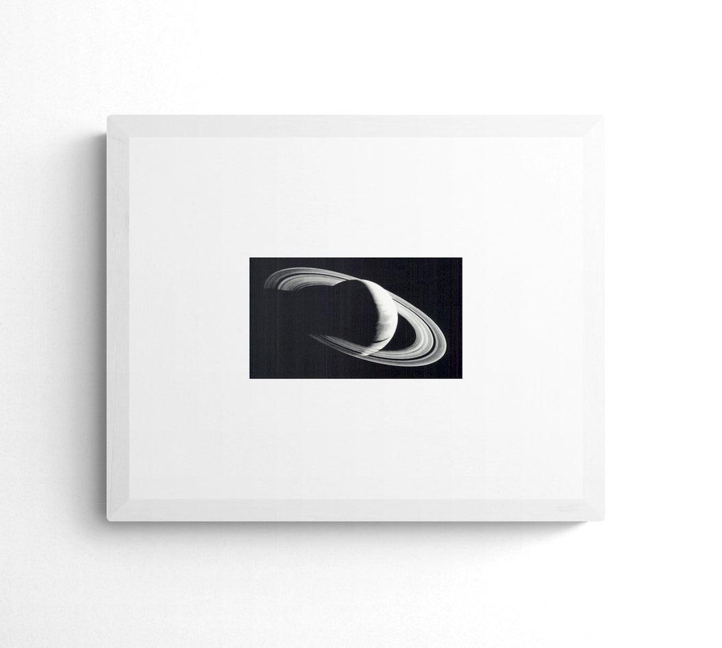Robert Longo - Untitled (Saturn), 2006 - 2006 Offset Lithograph 3.75" x 7.25": "Untitled (Saturn), 2006" by Robert Longo, 2006 Unsigned Offset Lithograph. Paper size is 3.75 x 7.25 inches, with an image size of 3.75 x 7.25 inches. The Offset Lithograph is from an unknown edition