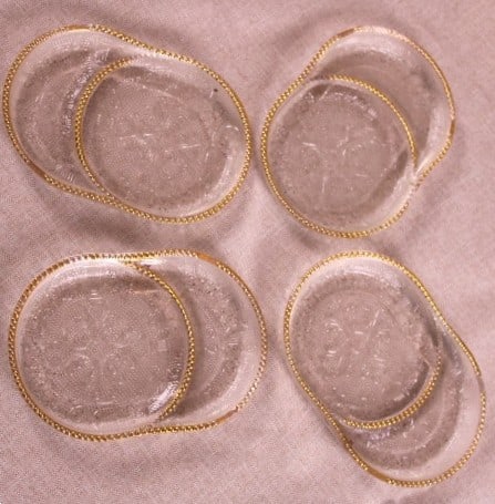 Vintage Jeannette Glass Tea Coasters: Vintage Jeannette Glass Tea Coasters set of 4 with Beautiful Beaded Gold Rim , Harp Motif. Produced in 1954 utilizing pressed glass craftsmanship, these pieces measure 5 inches across. They are well-s
