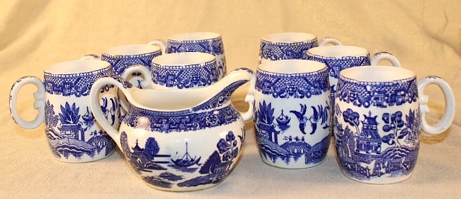 Blue Willow Tea Cups Creamer Pitcher: 8 Blue Willow Tea cups all handles intact some small chips and wear, no maker’s mark present, creamer pitcher no lid Mugs 3.5 x 3.125 Pitcher 4.5 w x 3 t x 3.5 D