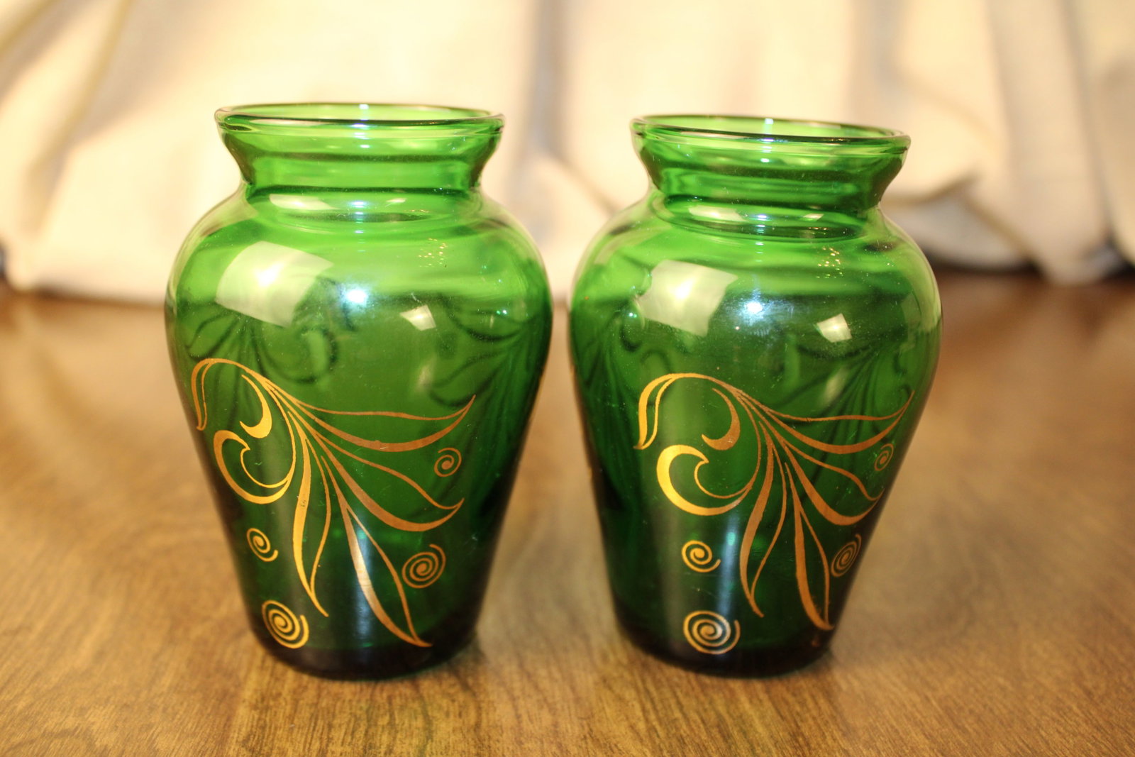 Retro Green Glass Vases: Pair of green glass vases with gold painted motif, vintage retro, beautiful design.