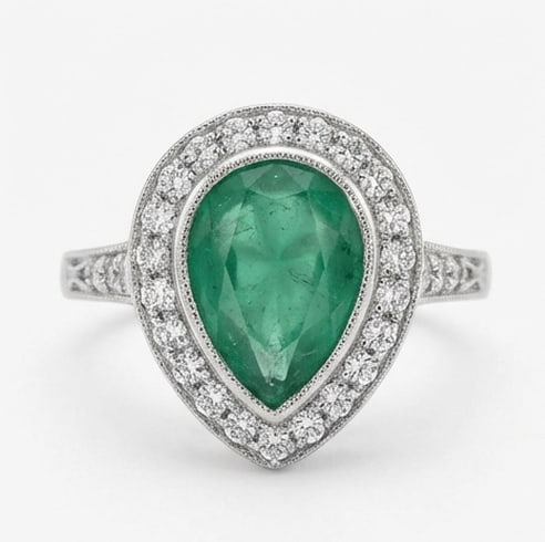 Certified 3.0 Ct Pear Natural Emerald 14K White Gold Vintage Halo (Milgrain Detail) Ring: This certified fine jewelry piece features a 3.0 carat natural Emerald in a Pear cut, crafted in 14K White Gold. The Vintage Halo (Milgrain Detail) design highlights the beauty of the natural center s