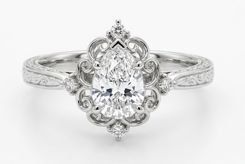 Delicate 3.00 CT Pear Cut Lab Grown Diamond Victorian Lace Ring in 14K White Gold: Description This artistic design features a 3.00 Carat Pear Cut Lab Grown Diamond held within an intricate lace-like filigree frame The mounting mimics delicate Victorian wirework with milgrain accent