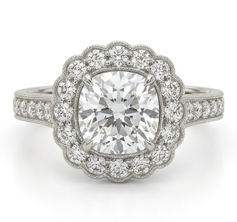 Exquisite 6.00 CT Cushion Cut Lab Grown Diamond Scalloped Halo Ring in 14K White Gold: Description This feminine design features a 6.00 Carat Cushion Cut Lab Grown Diamond encased in a unique scalloped floral halo The petal inspired setting is adorned with shimmering accent diamonds tha