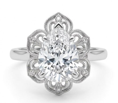 Grand 6.00 CT Pear Cut Lab Grown Diamond Filigree Lace Ring in 14K White Gold: Description This artistic design features a 6.00 Carat Pear Cut Lab Grown Diamond held within an intricate lace like filigree frame The mounting mimics delicate Victorian wirework with scalloped milgr