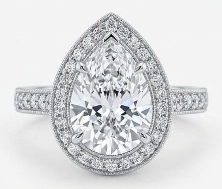 Radiant 6.00 CT Pear Cut Lab Grown Diamond Victorian Halo Ring in 14K White Gold: Description This feminine and sophisticated design features a 6.00 Carat Pear Cut Lab Grown Diamond encased in a shimmering halo of brilliant accent diamonds The 14K White Gold band is adorned with in