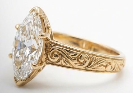 6.00 CT Lab grown diamond Lab-Grown Ring in Yellow Gold: An exceptional 6.00 carat lab-grown lab grown diamond ring, expertly crafted in luxurious Yellow Gold. The marquise cut solitaire on a vintage-style band with deep scroll engraving design highlights t