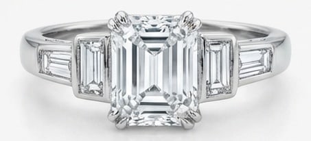 6.00 CT Lab grown diamond Lab-Grown Ring in White Gold: An exceptional 6.00 carat lab-grown lab grown diamond ring, expertly crafted in luxurious White Gold. The emerald cut center stone flanked by tapered baguette side stones design highlights the brillia